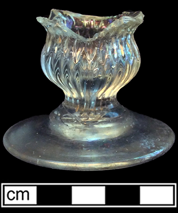 Colorless soda lime glass, possible salt or dessert glass; pattern molded in double ogee form, molded gadroon at bottom of bowl and diamonds above. Base diameter: 2.75”. Lot 187-45A. 18BC66