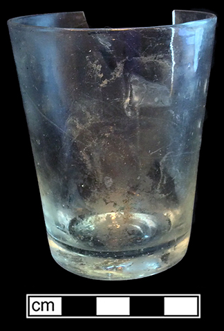 Tumbler of colorless soda lime glass. Empontilled. Rim diameter: 2.75”, Base diameter: 2.13”, Vessel height: 3.50”. Lot 187-36. 18BC66