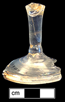 Colorless leaded glass wine glass with plain stem and domed foot and folded foot ring. Foot diameter:  3.0”. Folded foot ring began to disappear around 1740. Plain stems common c. 1730-1775 (Bickerton 1986:19). 18BC33