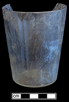 Colorless soda lime glass tumbler with molded flat panels.  Empontilled. Rim diameter: 3.00”; Base diameter: 2.25”; Vessel height: 3.60”. Lot 190-56. 18BC66.