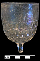 Colorless leaded stemmed glass.  Press molded oval dimples on body. Rim diameter:  3.00”. Lot: 100. 18BC80