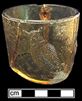 Amber glass “Bird on Branch mug; part of Beaded Handle set produced by the Bryce Brothers in the 1880s, when the company may have been known as Bryce, Walker & Co. The Brewhouse mug is missing its pleated skirt base. 18CV13