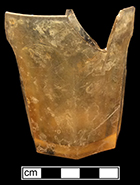 Colorless leaded glass panelled tumbler.  7-sided base. 3” height; 3.5” rim diameter; 2.25” base diameter (widest point). The yellowish color to this vessel is believed to be caused by post-depositional factors. 18BC27-F30