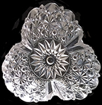 Colorless soda lime press molded 3-sided nut dish. Similar to pattern Ellrose (paneled button and daisy) by George Duncan & Sons or US Glass Company c. 1885-1898. 18CV13.  Complete example on right from a private collection.