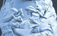 Detail of blue molded jug showing horse and rider pursued by a ghost.