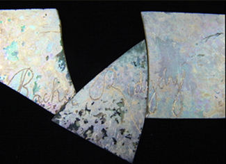 Three fragments of window glass with engraved name Rachel Ridgeley.