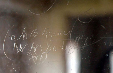 Window from Mt. Calvert with words engraved into the glass.