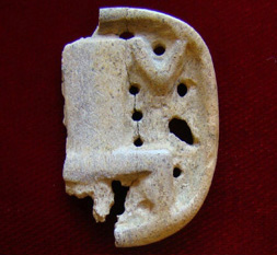 Carved bone item.