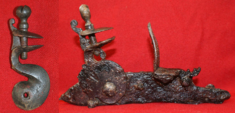Two gun cocks from the Addison site collection.