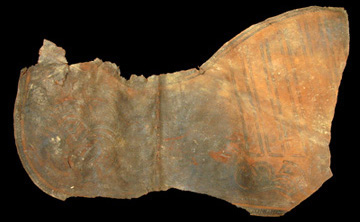 Butterfly-shaped piece of leather from a saddle.