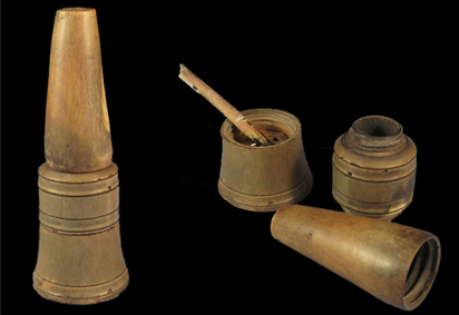 On the right, the disassembled portions of an 18th century writing kit consisting of three pieces-an inkhorn, a pounce pot and a penner. Kit is assembled at left.