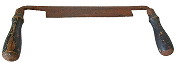 Figure 2 Iron drawknife with deteriorated wooden handles showing orange rust on the metal blade and paint remnants on the cylindrical handles.