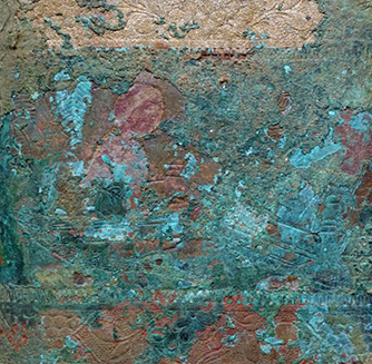 Figure 2 Close-up detail of heavily corroded copper alloy surface showing bright turquoise-green patina with areas of brown and reddish corrosion, revealing decorative engraved designs beneath the deterioration layer.