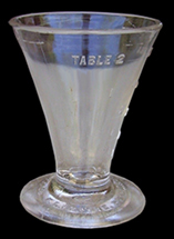 A conical shaped glass cup