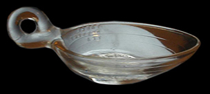 A glass spoon bowl, with lines to mark dosages along the side.