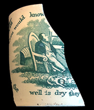 Ceramic fragment of mug, depicting a Victorian man seated in a chain at home, with dog on floor. 
