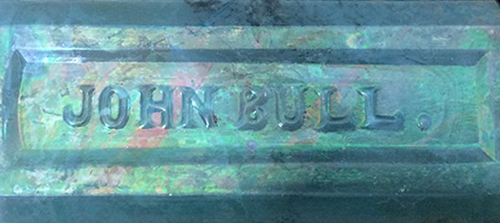 Detail of bottle showing molded words 