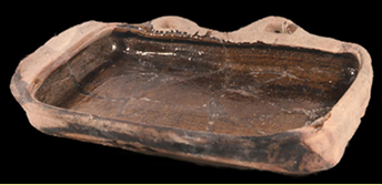 Complete example of an earthenware basting pan from the 1600s.