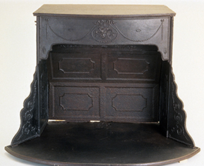 Black-painted cast iron Franklin stove with open double doors revealing interior fire chamber with paneled design.