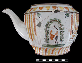 Almost complete teapot molded and painted with a classical human figure.