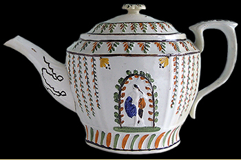 Complete molded and painted teapot showing the classical figure of Apol