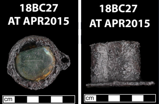 Circular iron and glass flea glass from a Baltimore archaeological site.