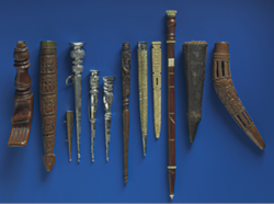 Collection of ten historical knitting  needle sheaths displayed on blue background.