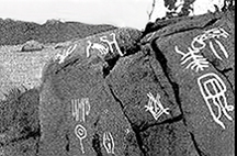 Photograph of rock petroglyphs painting with chalk.
