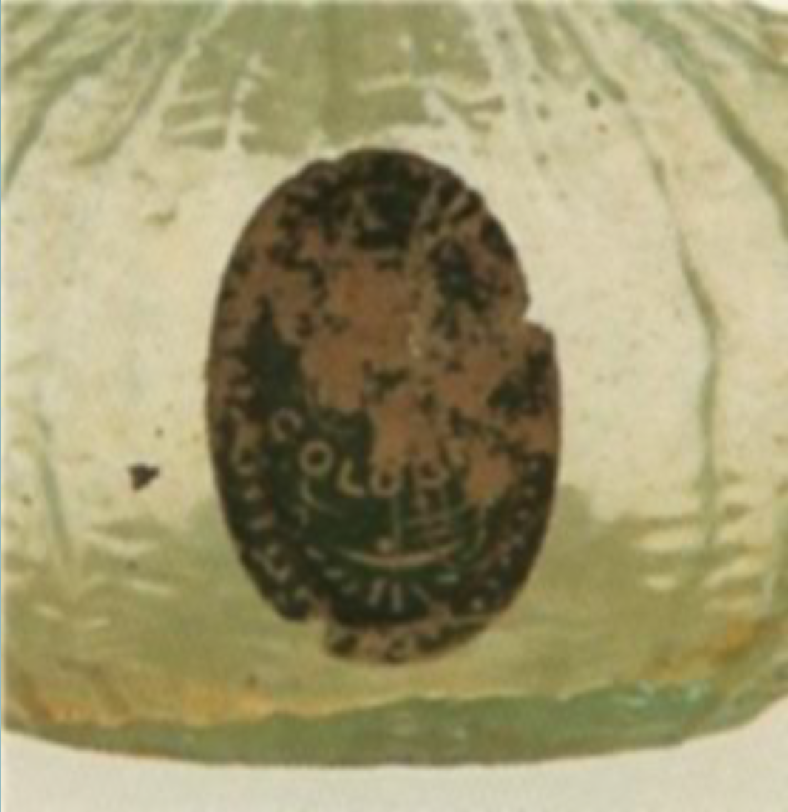 Oval paper label on a cologne bottle.