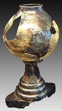 Fragmented and mended glass whale oil lamp from archaeological site in Baltimore.