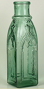 Green pickle bottle molded with Gothic-style arches.