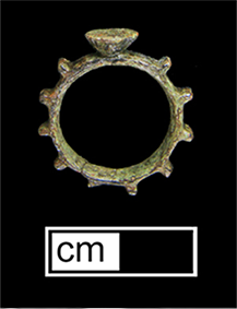 Side view of a copper alloy decade ring with ten knobs for praying the rosary.