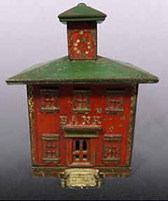 Complete painted and cast example of a cast iron bank shaped like a bank building with a cupola.