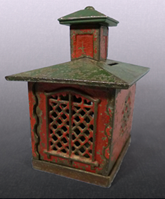 View of the back of the painted cast iron bank shaped like a bank building.