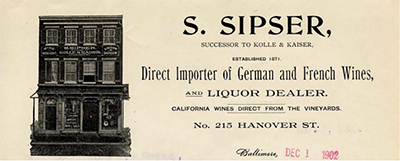 Brown and white stoneware liquor jug with S. Sipser letterhead printed on the white body of the vessel.