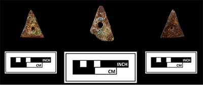 Photograph of three brass triangles