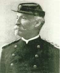 Black and white image of a Caucasian man in uniform with a large white
mustache and goatee.