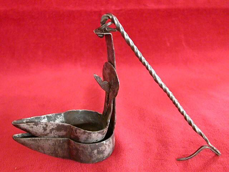 Photograph of metal oil lamp