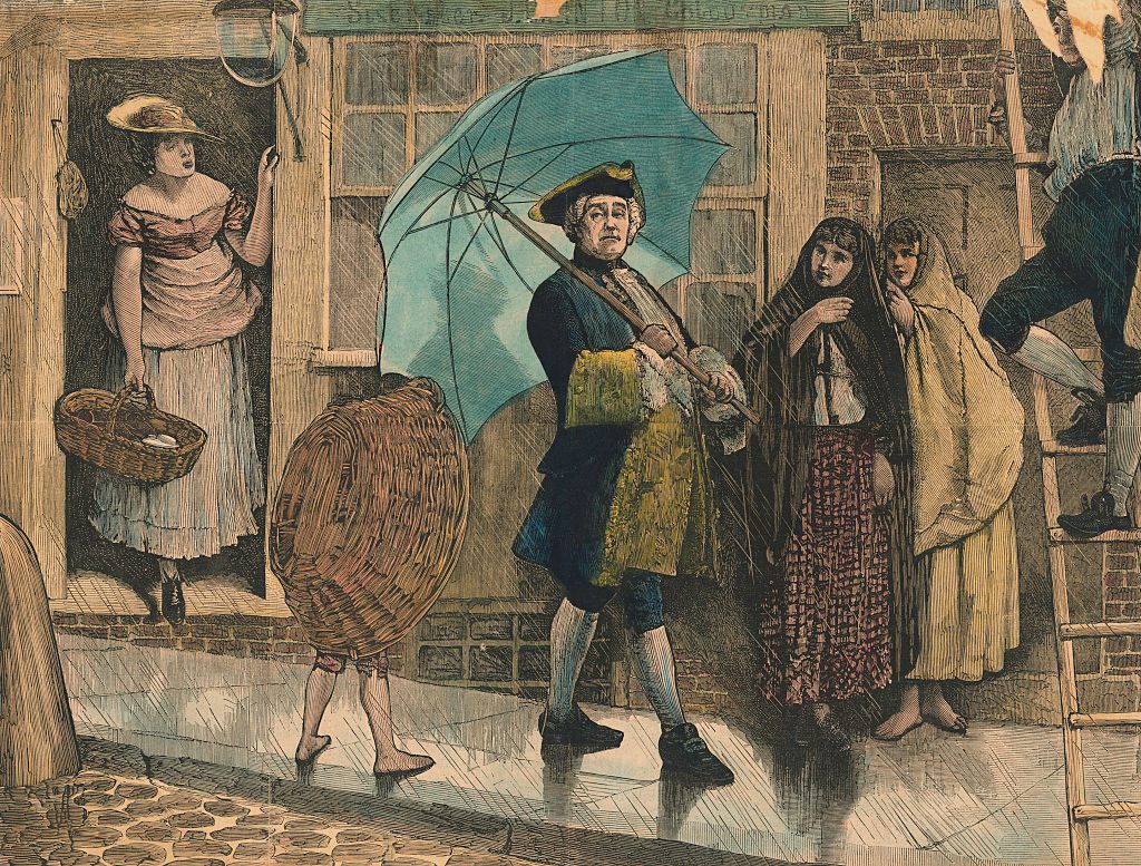 A colorized historic illustration of a 18 th century man with a large brightly colored umbrella. Other people around him stare in his direction and a small child is covered with a large basket, maybe mocking the gentleman.