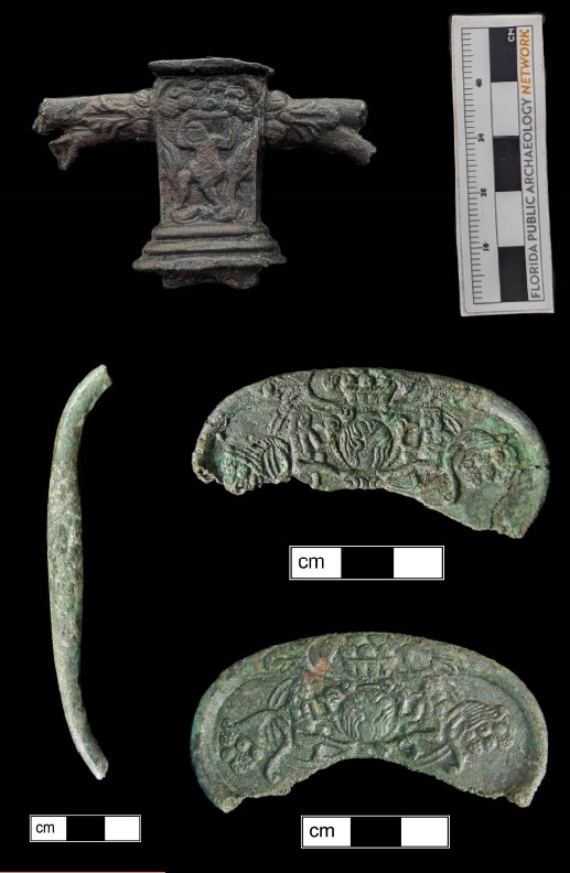 Array of smallsword parts on a black background.