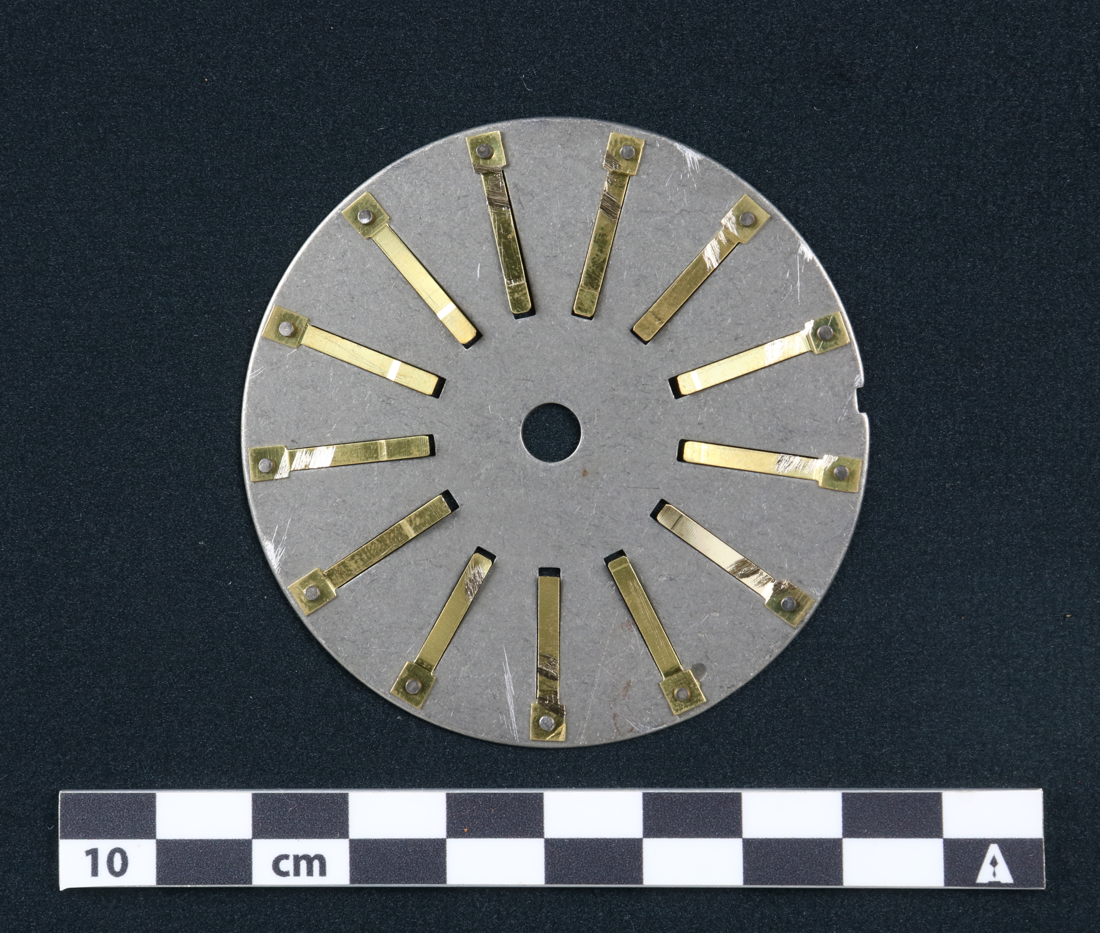 Figure 4 The outer cover of the modern pitch pipe removed showing 13 complete copper alloy
tongues riveted over 13 slots aligning with all half note of a musical scale.