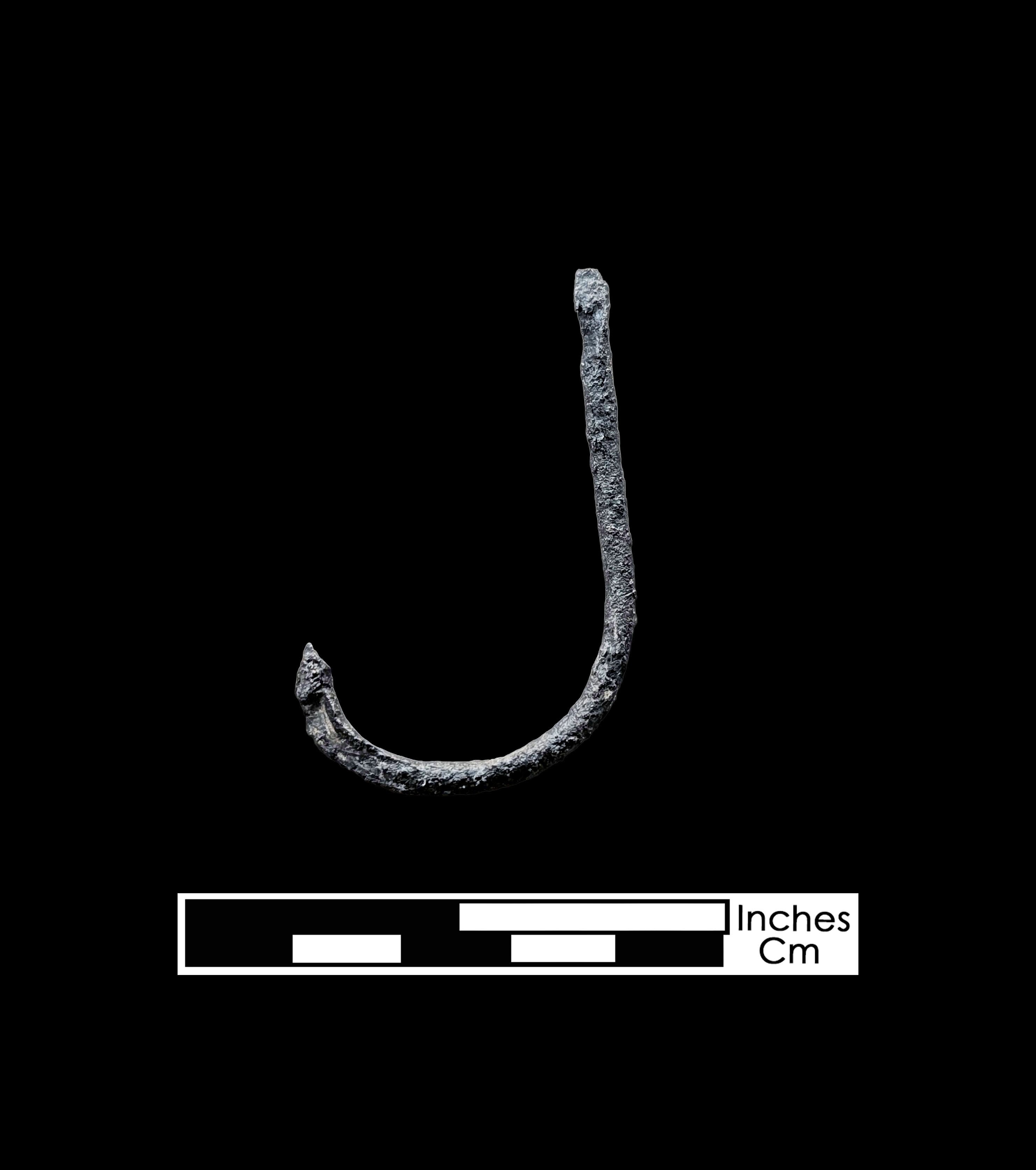 Curved rusted metal fishhook on a black background, with a digital scale at bottom of image.