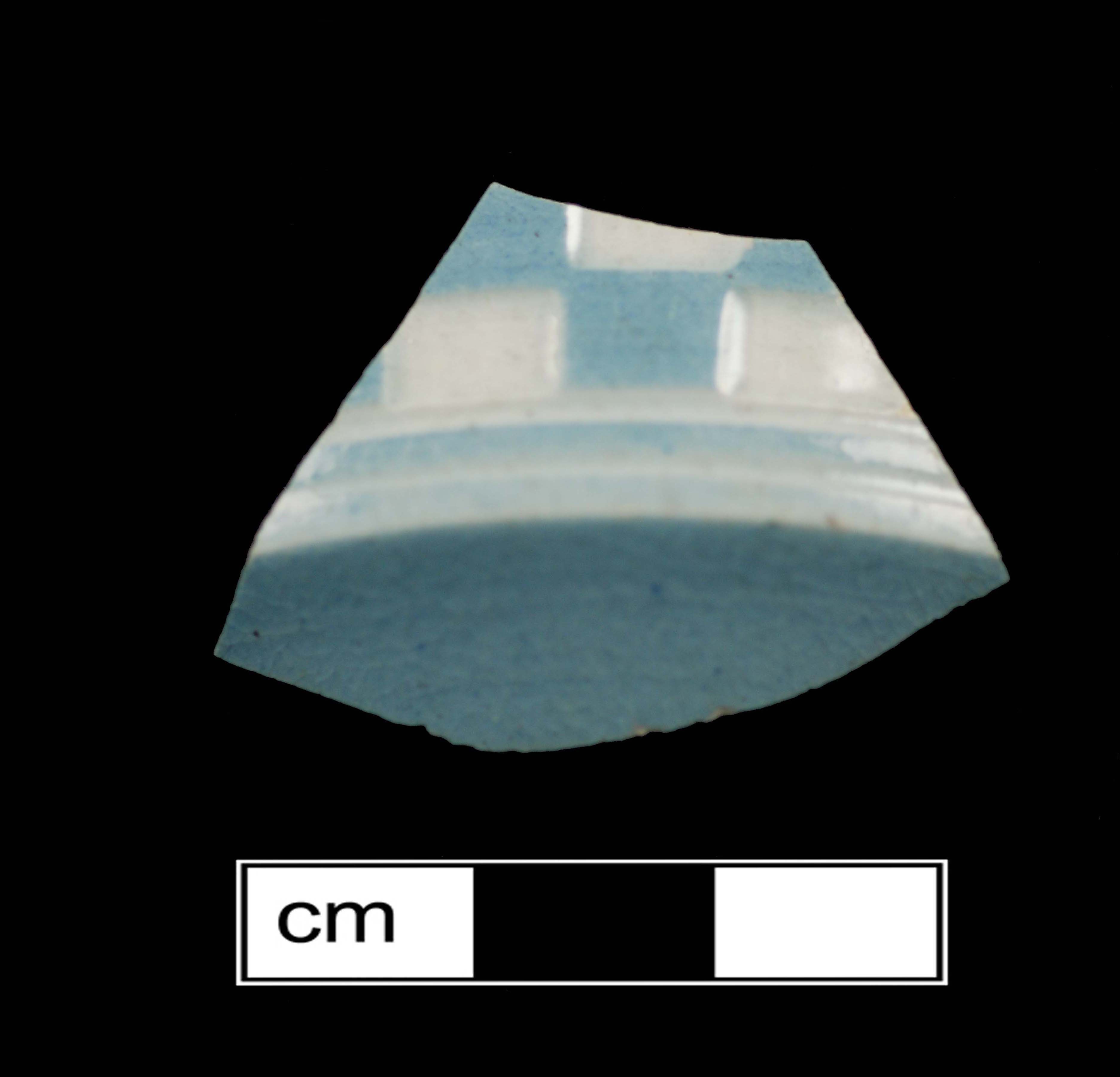 Image of dipped earthenware fragment.