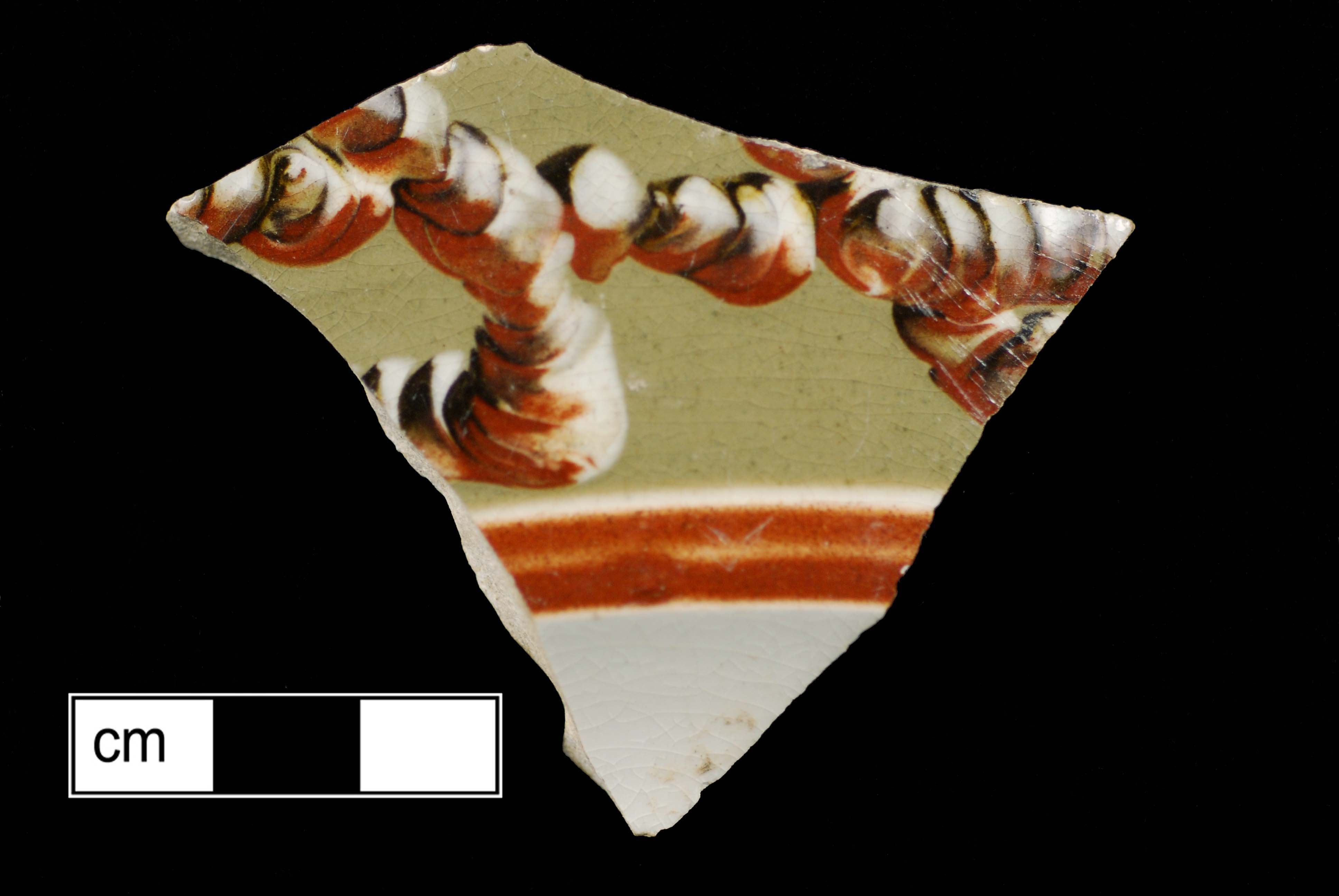 Image of dipped earthenware fragment.