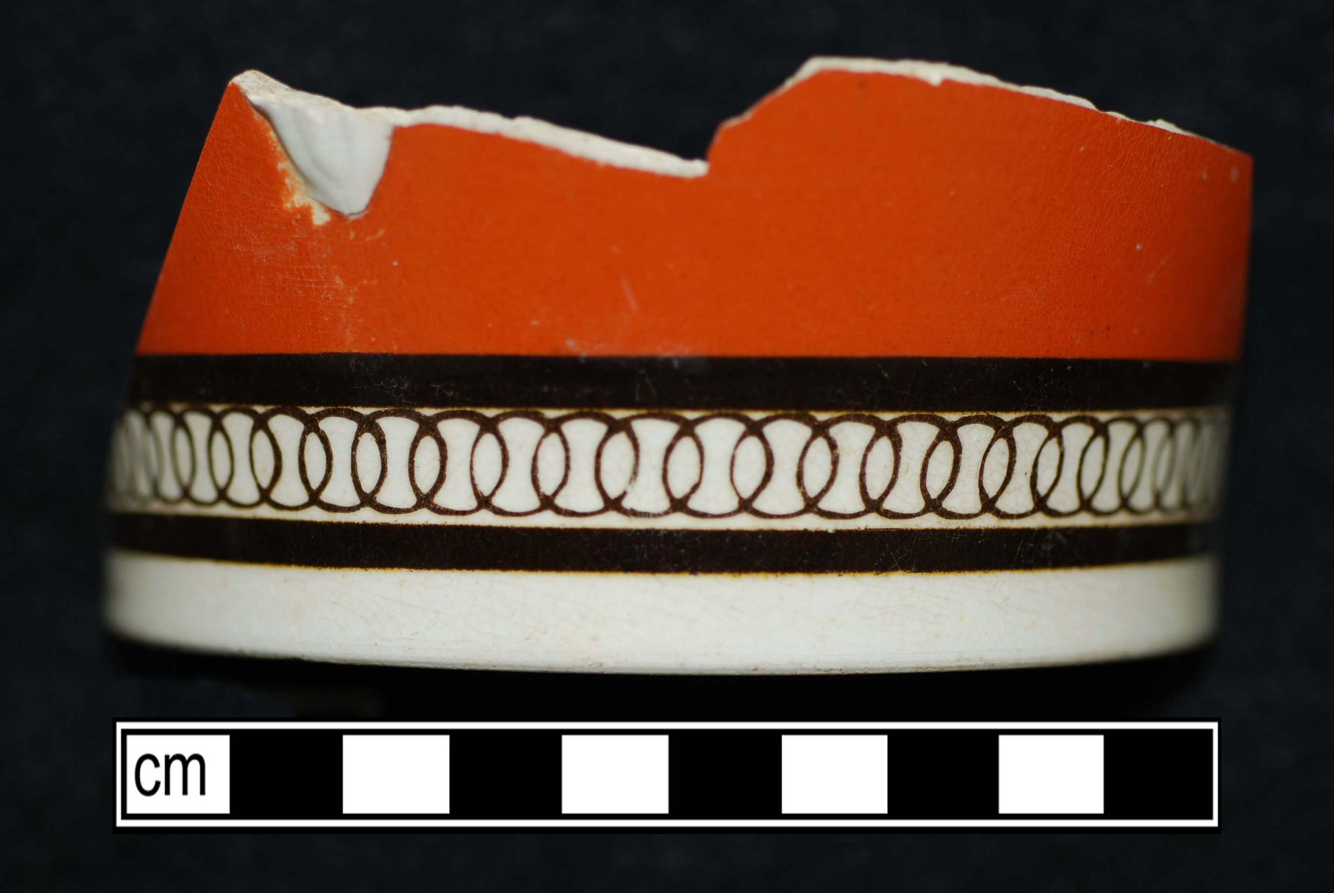 Image of dipped earthenware fragment.