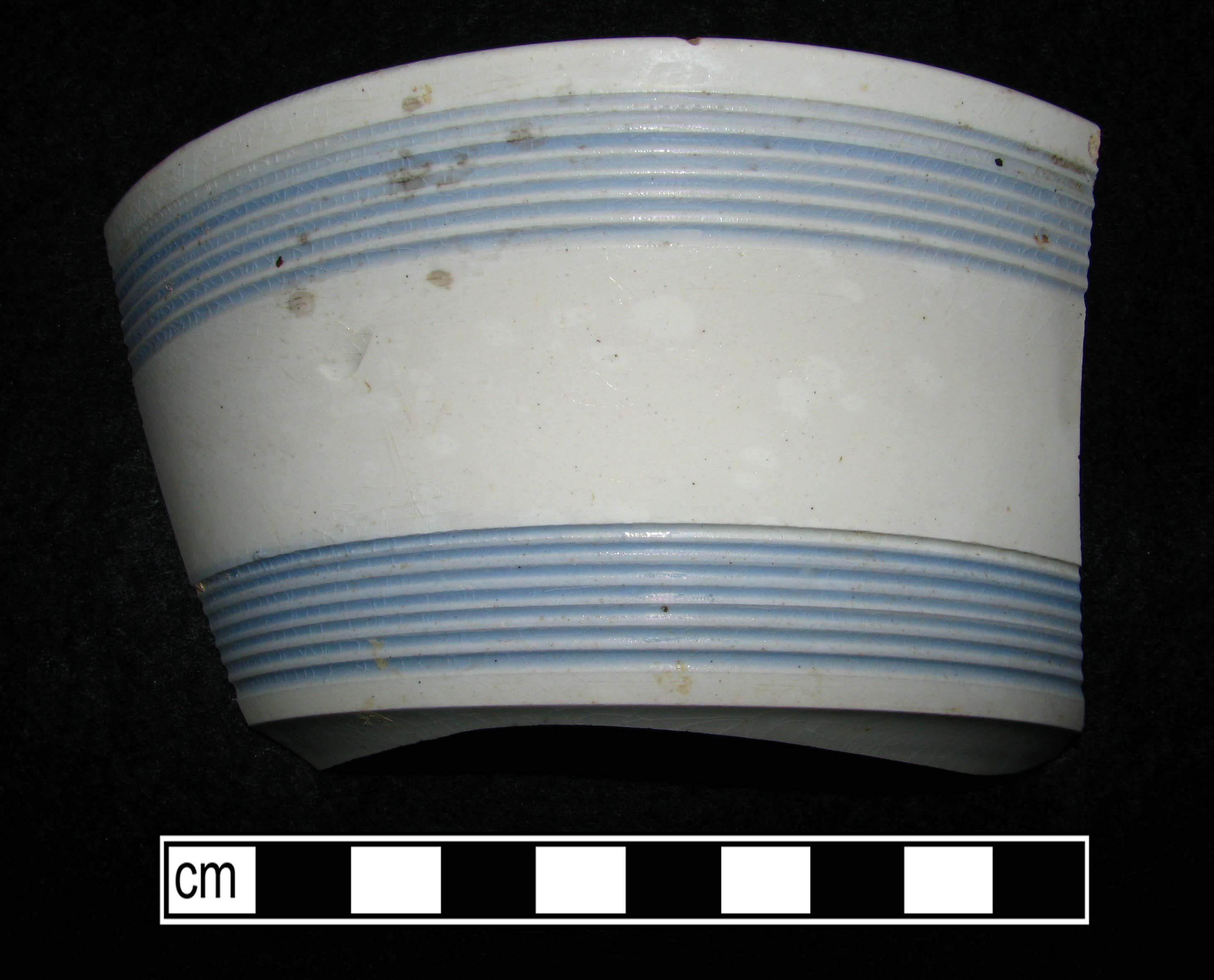 Image of dipped earthenware fragment.