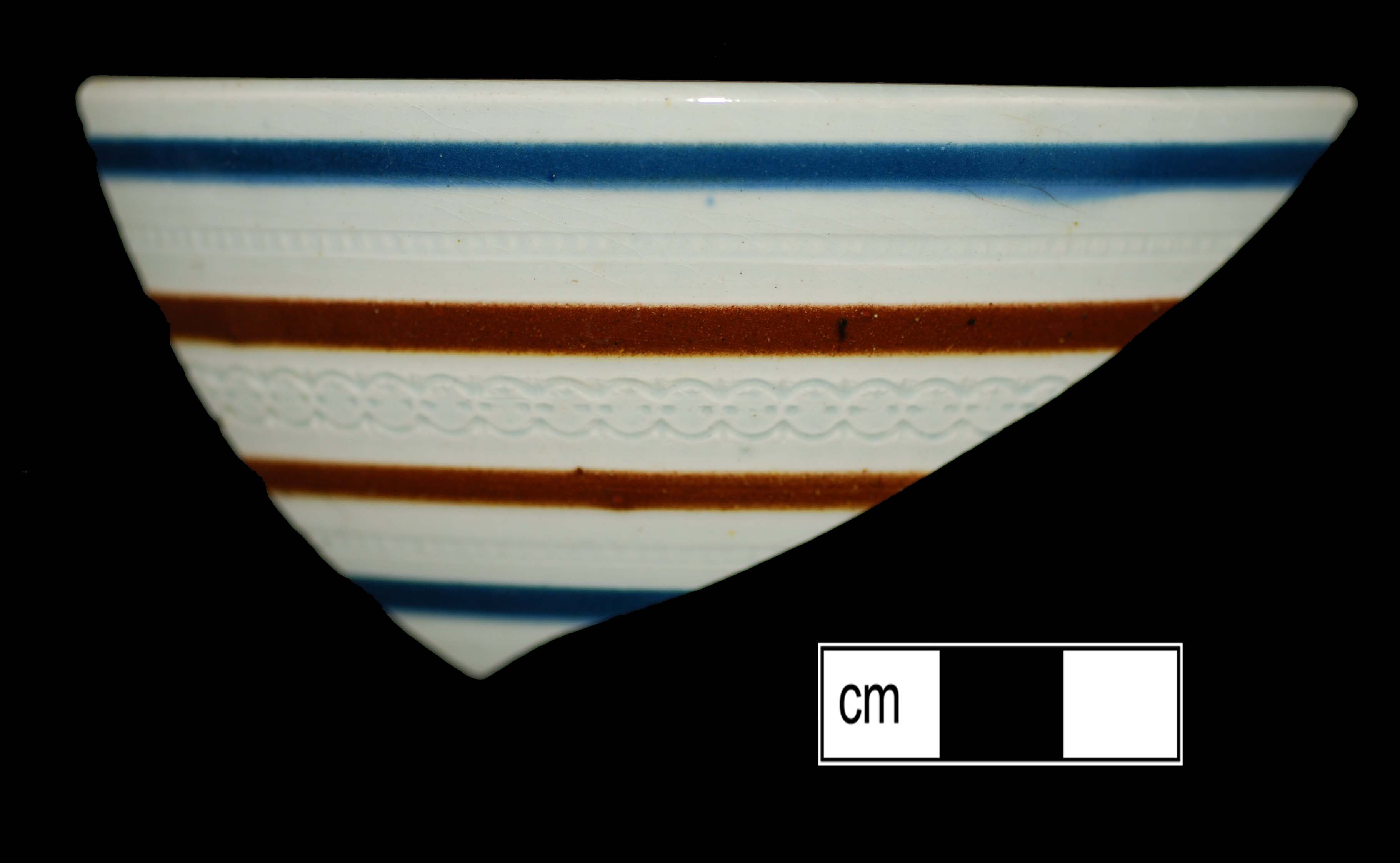 Image of dipped earthenware fragment.