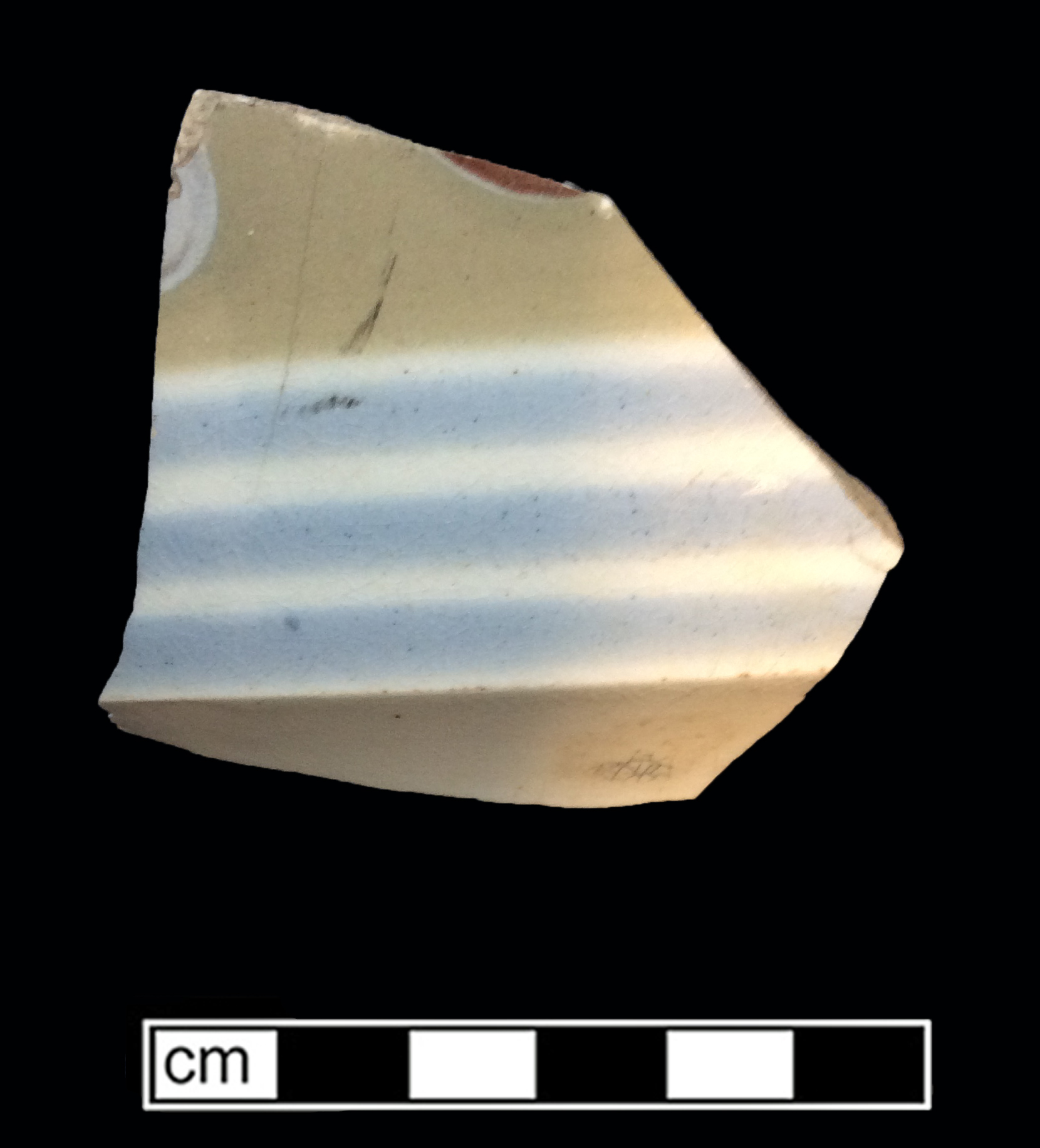 Image of dipped earthenware fragment.