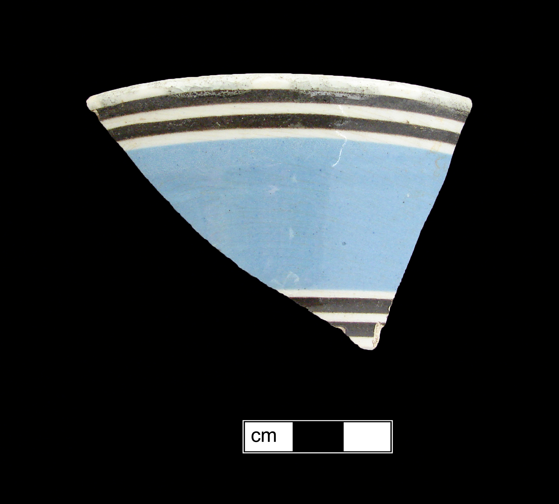 Image of dipped earthenware fragment.