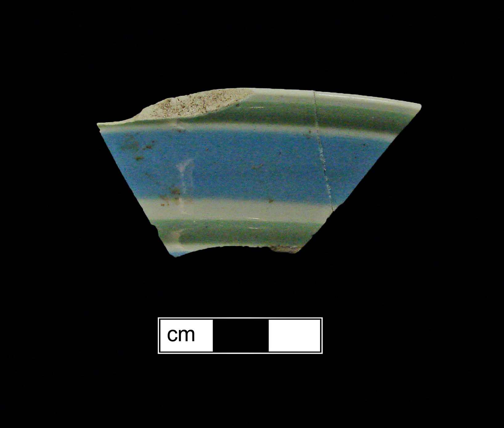 Image of dipped earthenware fragment.